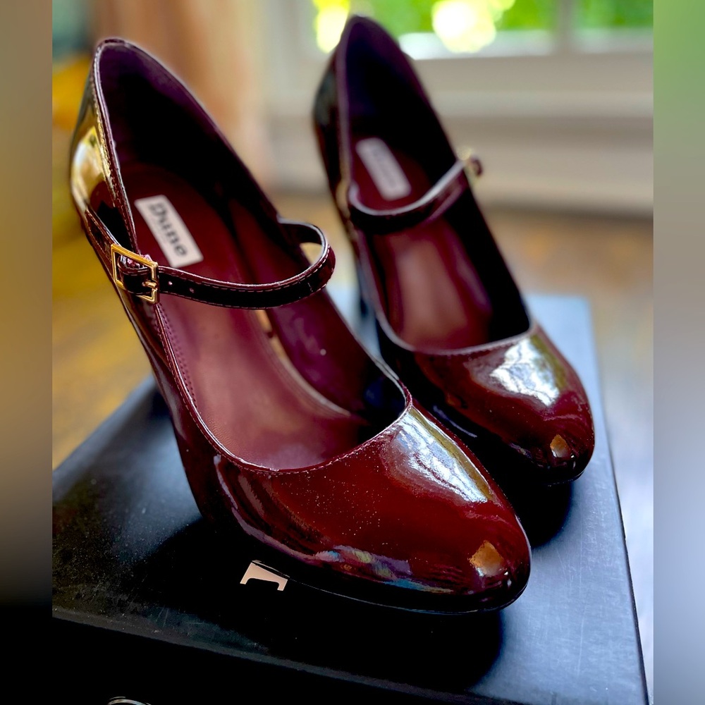 DUNE of London classic burgundy patent Mary Jane heels.
